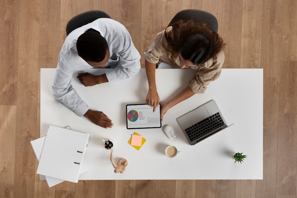 [fpdl.in]_top-view-colleagues-working-desk_23-2149762494_large